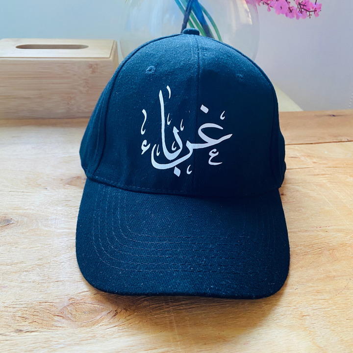 "غرباء" Cap