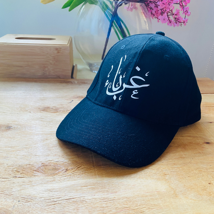 "غرباء" Cap